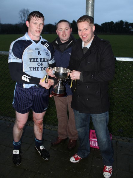 Alan Maguire presents Joe Maguire Memorial Cup to Belcoo Captain Seamus Conlon
